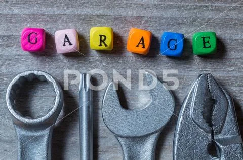 Garage letter cube and tool on gray wood visualization Stock Photos