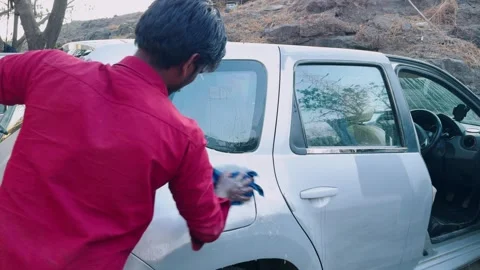 Garage man polishes spot using soaked cloth Stock Footage 307277851