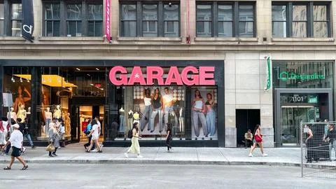 Garage store front featuring vibrant signage, showcasing trendy fashion displays Stock Photos