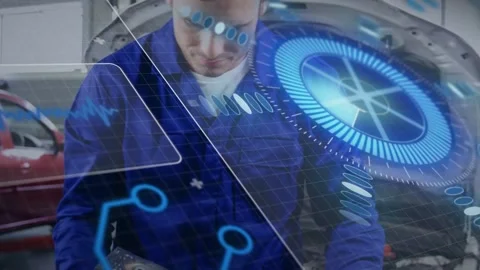 Garage tech picking up cylinder head from cart, starting HUD scan, rotating and Stock Footage 335282367