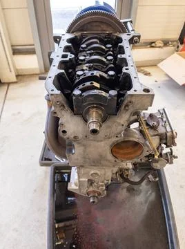 In a garage there is an opened engine block of a car Foto stock