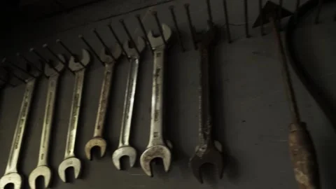 Garage Tools end wrenches hanging on hooks pan right Stock Footage 195999562