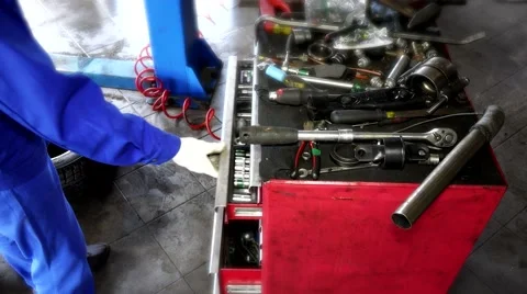 Garage worker showing various tools in drawer box Stock Footage 65266643