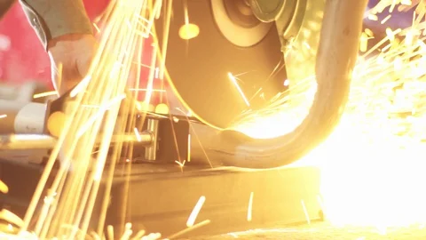 Garage worker use cutting grinder machine on metal pipe Stock Footage
