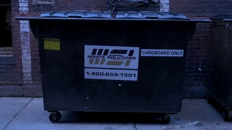 A garbage in an alley Stock Footage 73890013