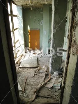 Garbage and dirt in the premises of an abandoned building. Stock Photos