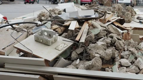 Garbage and a pile of construction debris in the yard of a house on the city 動画素材 247203996