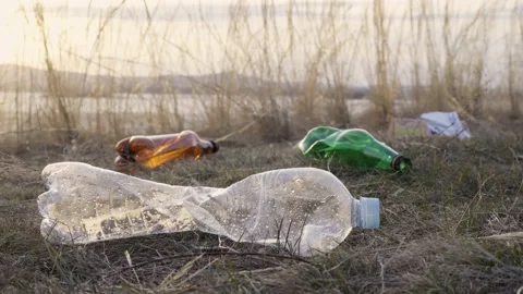 Garbage and plastic bottles after people's rest. Close-up. Stock Footage 238529500