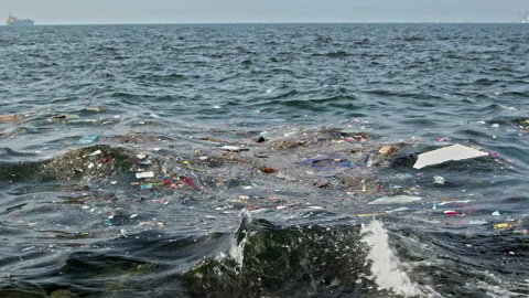 Garbage and Plastic Waste Pollution Floating in the Ocean Stock Footage 226666706