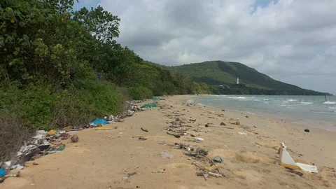 Garbage and trash on on sand beach in Vietnam plastic everywhere on the shore gl Stock Footage 124603390