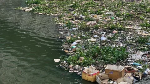 Garbage and wastewater polluting the Saigon River, Ho Chi Minh, Vietnam 4K Stock Footage 229540942