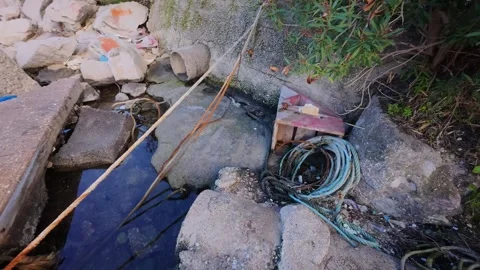 Garbage and Wreckage on the Beach After a Storm Vídeo Stock 303399482