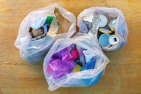 Garbage bag with different trash. Garbage sorting: iron, paper, plastic. Stock Photos