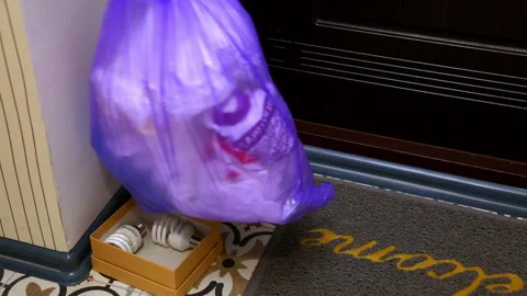 A garbage bag is placed at the entrance to the apartment. Full HD Stock Footage