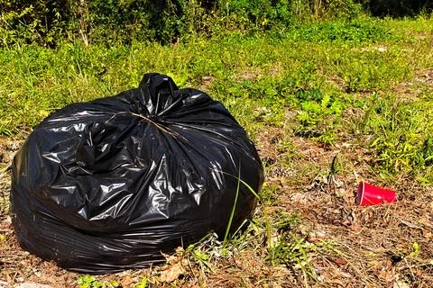 Garbage Bag on Side of Road Stock Photos