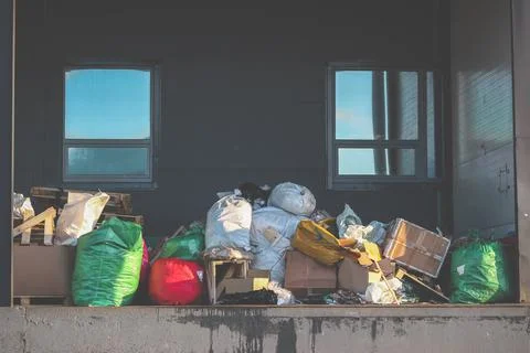 Garbage bags and boxes on the loading dock. Waste removal Stock Photos