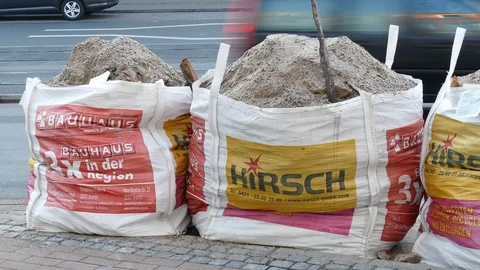 Garbage bags filled with rubble standing on the street, Germany, Europe Stock Footage 122989368