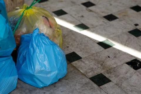 Garbage bags on the floor Stock Photos