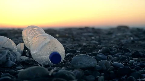 Garbage at beach: plastic bag and plastic bottle Stock Footage 70199807