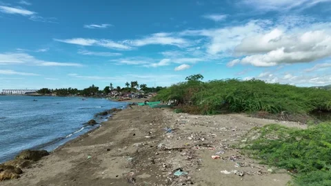Garbage beach plastic drone aerial waste Cebu landfill ocean pollution bottles Stock Footage 314335645