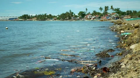 Garbage beach sea plastic waste Cebu landfill ocean pollution bottles coast Video stock 314993548