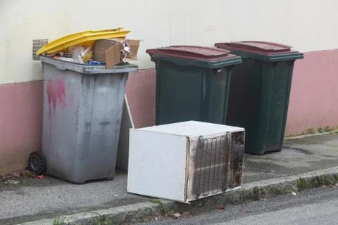 Garbage bin and left-behind fridge in Brest Stock Photos