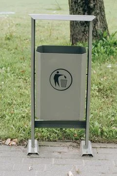 Garbage bin or can and bench on street, Different objects, selective focus Stock Photos