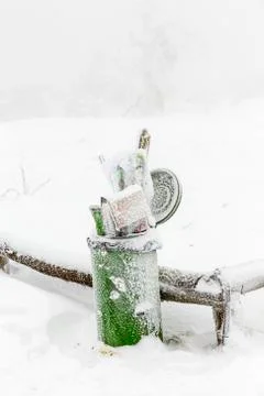Garbage bin in winter and snow blizzard at the Feldberg in Hesse Stock Photos