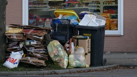 Garbage bins, boxes, old cardboard, yellow bags for plastic waste, yellow bin Stock Footage 122271359