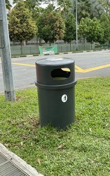 Garbage bins next to the road Stock Photos
