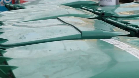 Garbage bins ready for collection pan right Stock Footage 69187571