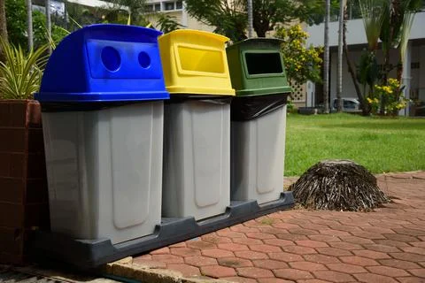 Garbage bins separated by colors Stock Photos