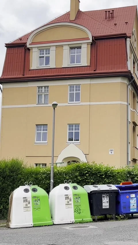 Garbage bins for sorting garbage in a European city. The problem of garbage in Stock Footage 250386347