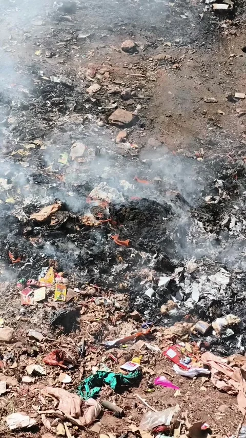 Garbage burning causing air pollution in rural area Stock Footage 324586555