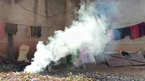 Garbage Burning Producing Thick Smoke Near Residential Area Видео 330325578