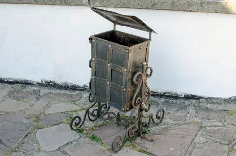 Garbage can with forged patterns. Stock Photos