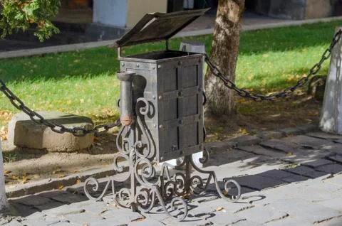 Garbage can with forged patterns. Stock Photos