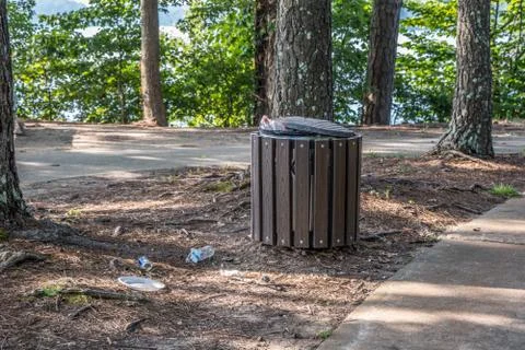 Garbage can overflow in the park Stock Photos