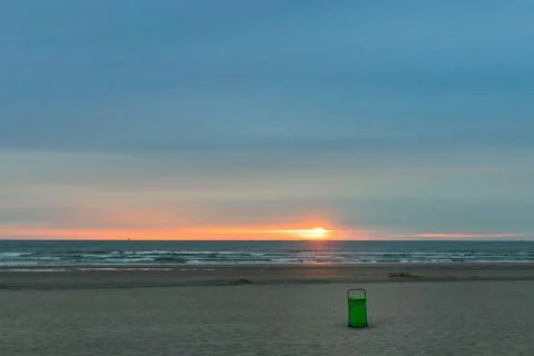 Garbage Can on a sunset beach Stock Photos