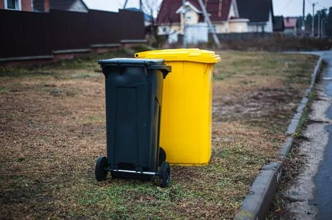 Garbage cans in different colors symbolizing recycling Stock Photos