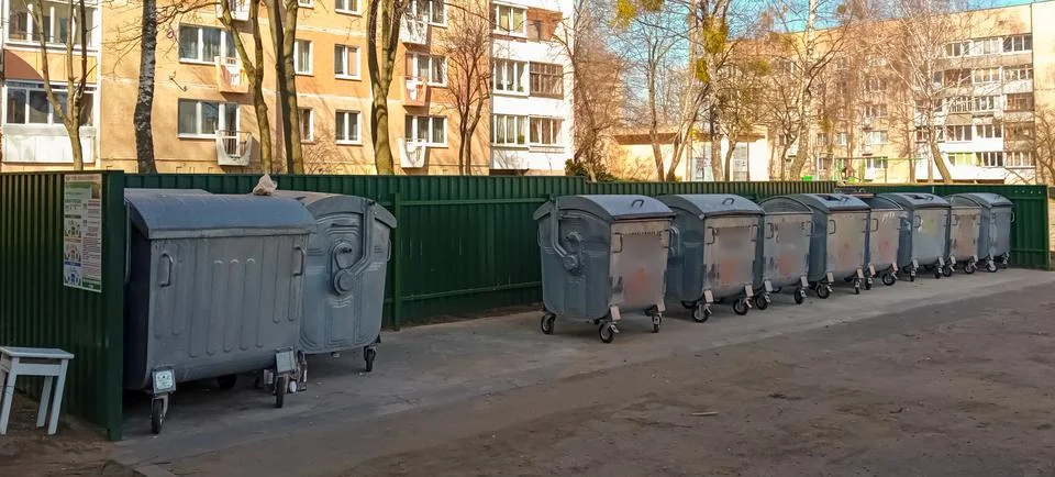 Garbage cans in the yards. Stock Photos