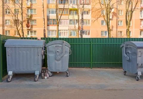Garbage cans in the yards. Stock Photos