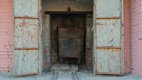 Garbage chute with large trash container in dirty mine place Stock Footage 339090698