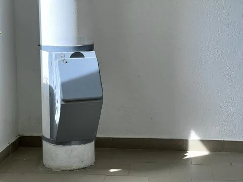Garbage chute located on the stairwell of a multi-storey building Foto stock