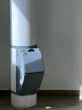 Garbage chute pipe in a multi-storey residential building on a stairwell Foto stock