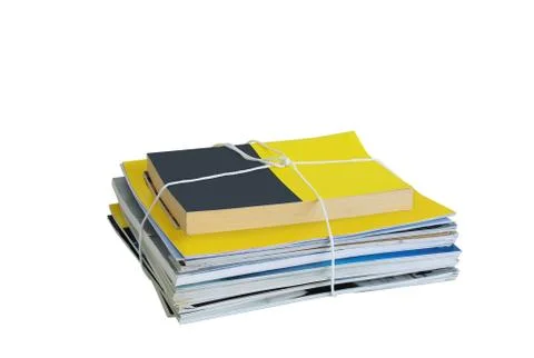 Garbage collection. A bundle of magazines tied with a rope. White isolate Stock Photos