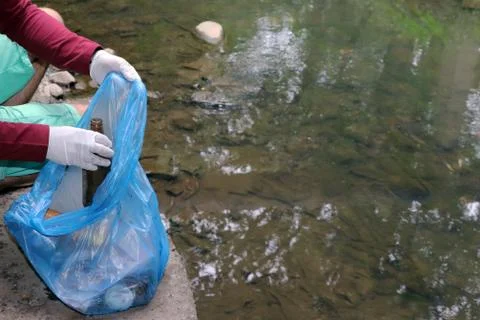 Garbage collection in the environment. Environmental pollution by plastic. A Stock Photos
