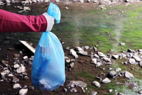 Garbage collection in the environment. Environmental pollution by plastic. A Stock Photos
