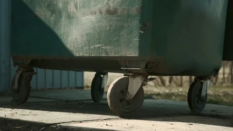 Garbage Collection.Scavenger Rolls out the Garbage Collection Container to the Stock Footage 87343879