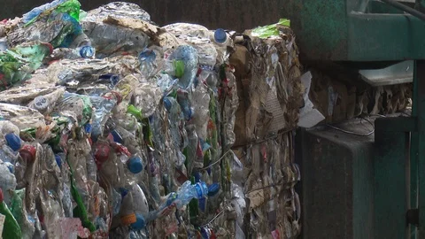 Garbage compressed into bales in industry Stock Footage 121999787